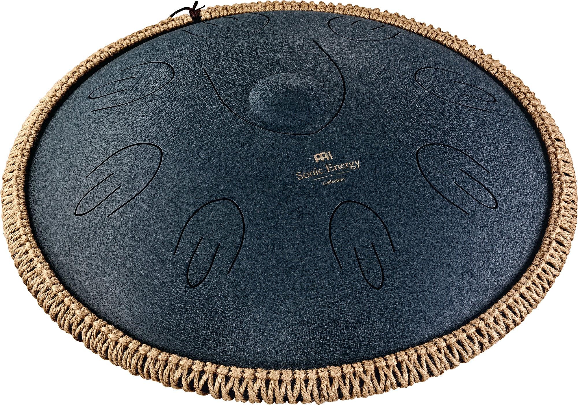 Steel tongue drum with engraved notes and woven rope edge for sound healing or meditation.