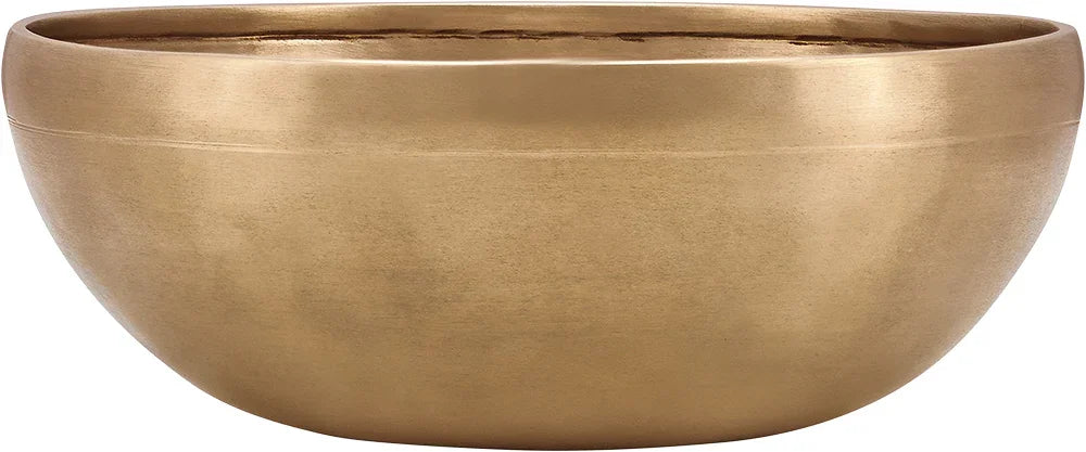 Large brass singing bowl for sound healing on white background