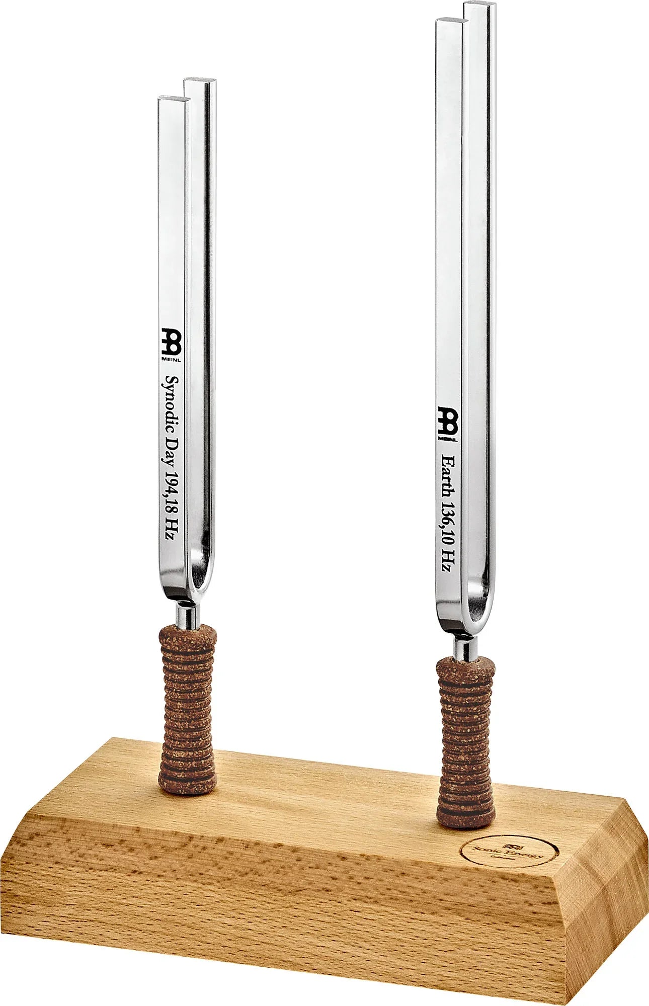Two Meinl tuning forks for sound healing on a wooden base, labeled Synodic Day and Earth frequencies.