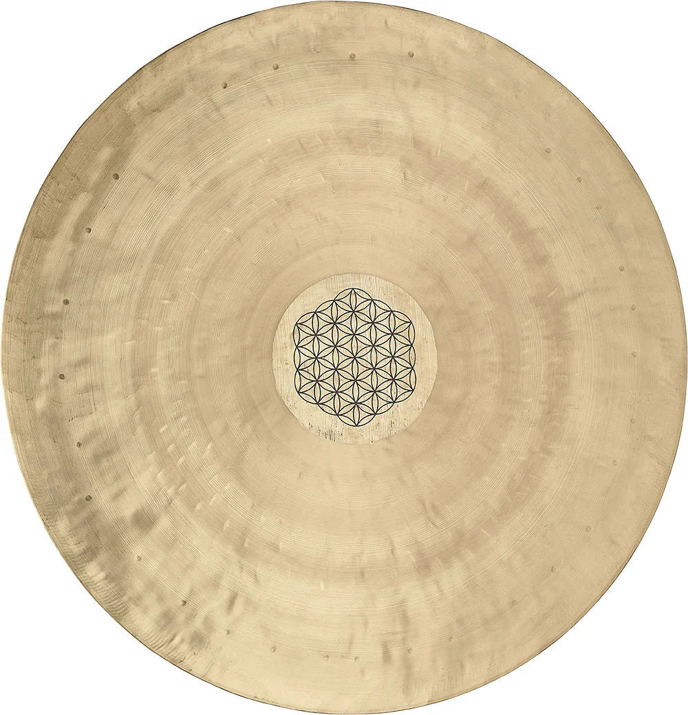 Bronze gong with geometric mandala design, used for sound healing and meditation.