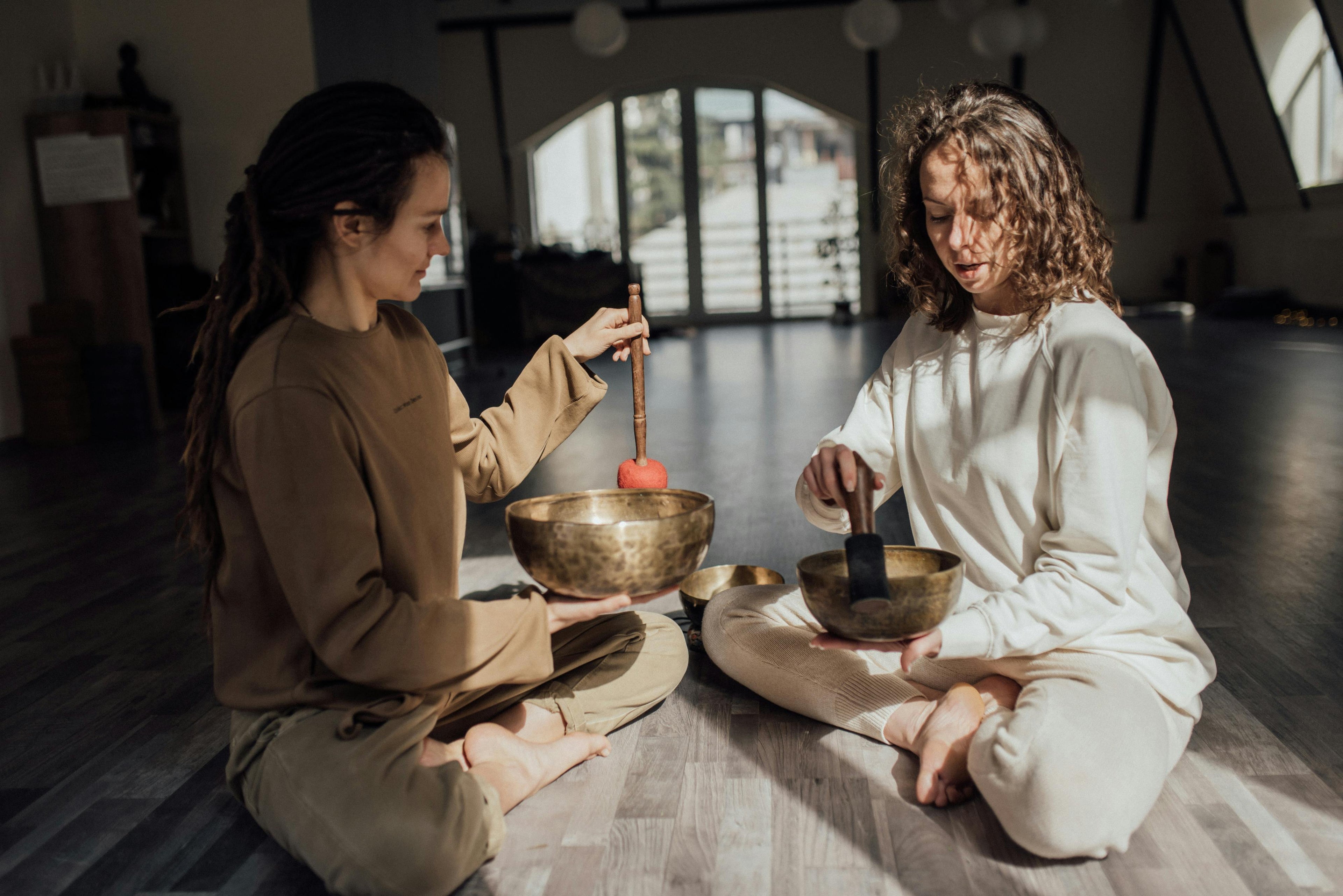 Sound Healers playing tibetan singing bowls from Spirit of Sounds based in Woods Cross, Utah.