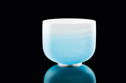 Blue frosted crystal singing bowl for sound healing on black background