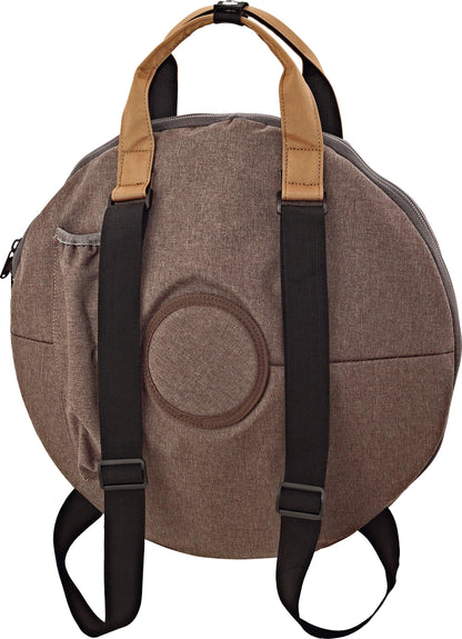 Round brown drum bag backpack with handles and front pocket, ideal for instrument transport