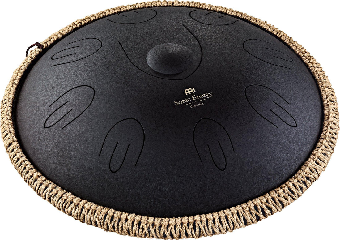 Black steel tongue drum with engraved note patterns and braided rope edge, for sound healing