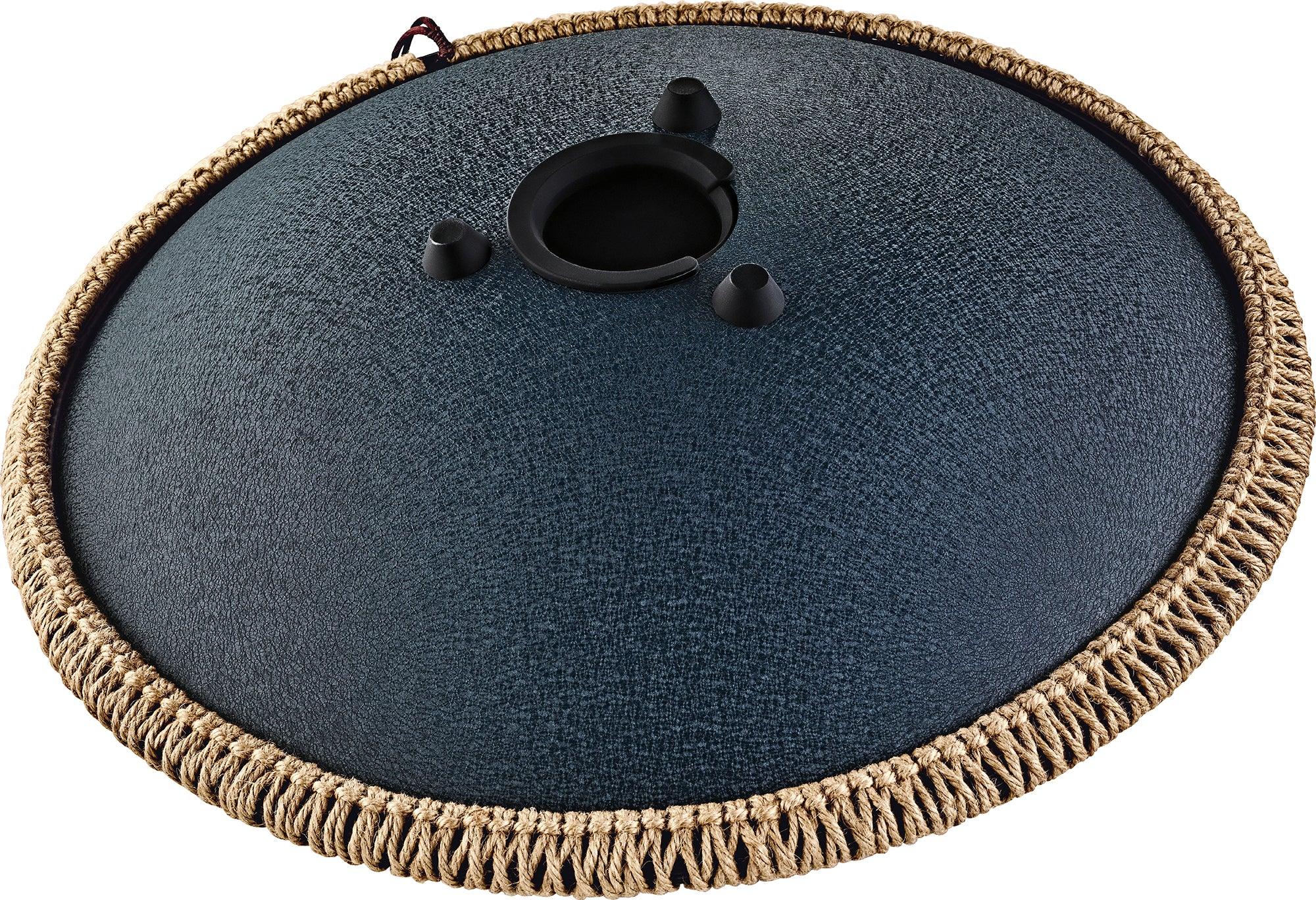 Blue tongue drum with rope edge, black center, and three rubber feet for sound healing