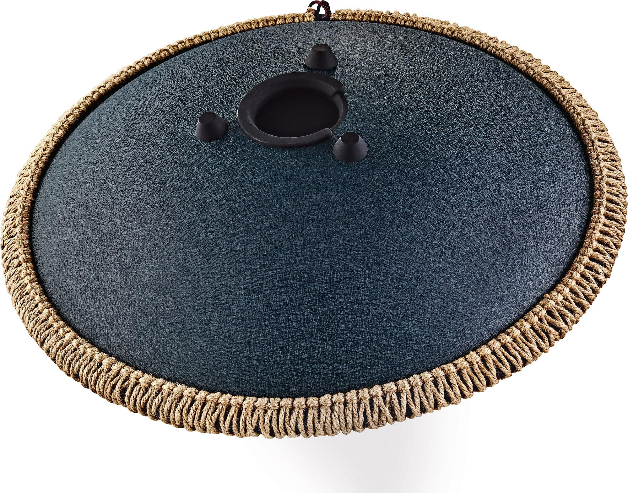 Steel tongue drum with textured black finish and woven rope edge, sound healing instrument