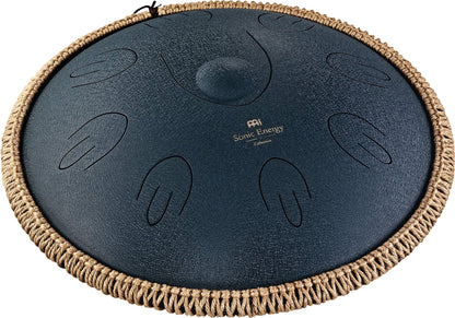 Steel tongue drum with engraved notes and woven rope edge for sound healing or meditation.