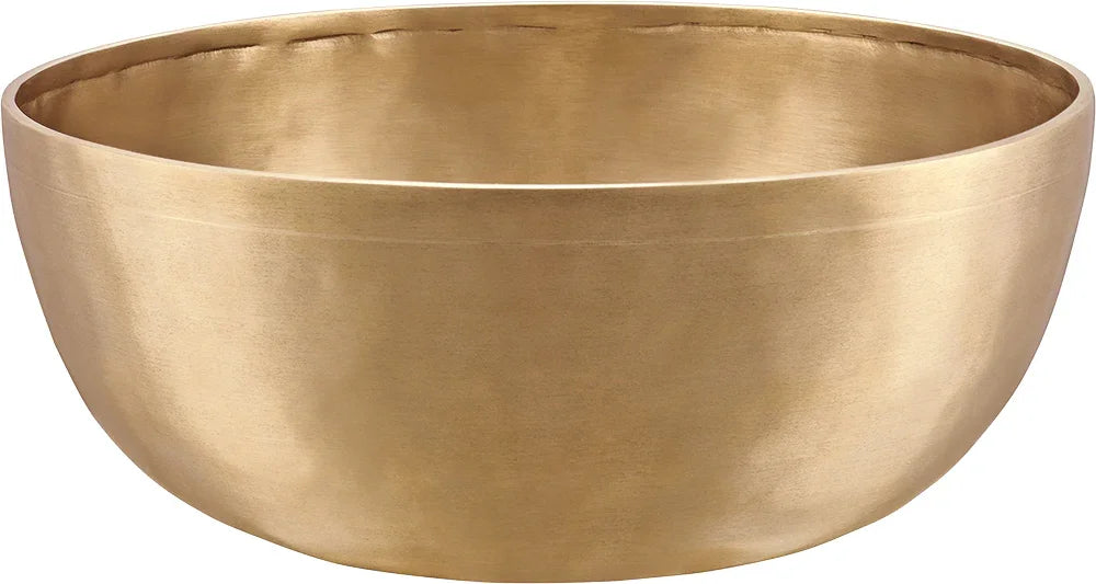 Brass singing bowl for sound healing and meditation on white background