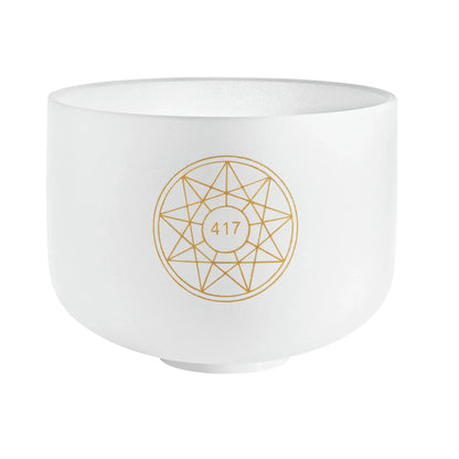 White crystal singing bowl with gold geometric design and number 417, used for sound healing