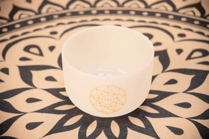 Crystal singing bowl with 741 Hz symbol on a patterned mat, for sound healing and meditation