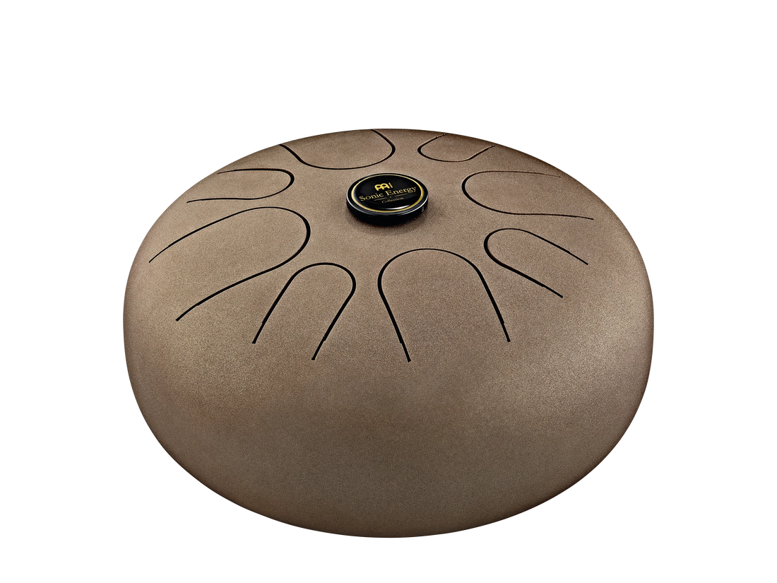 Brown steel tongue drum percussion instrument with sound healing design, isolated on white