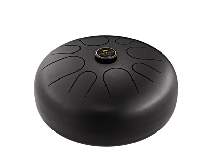 Black steel tongue drum for sound healing and meditation, isolated on white background