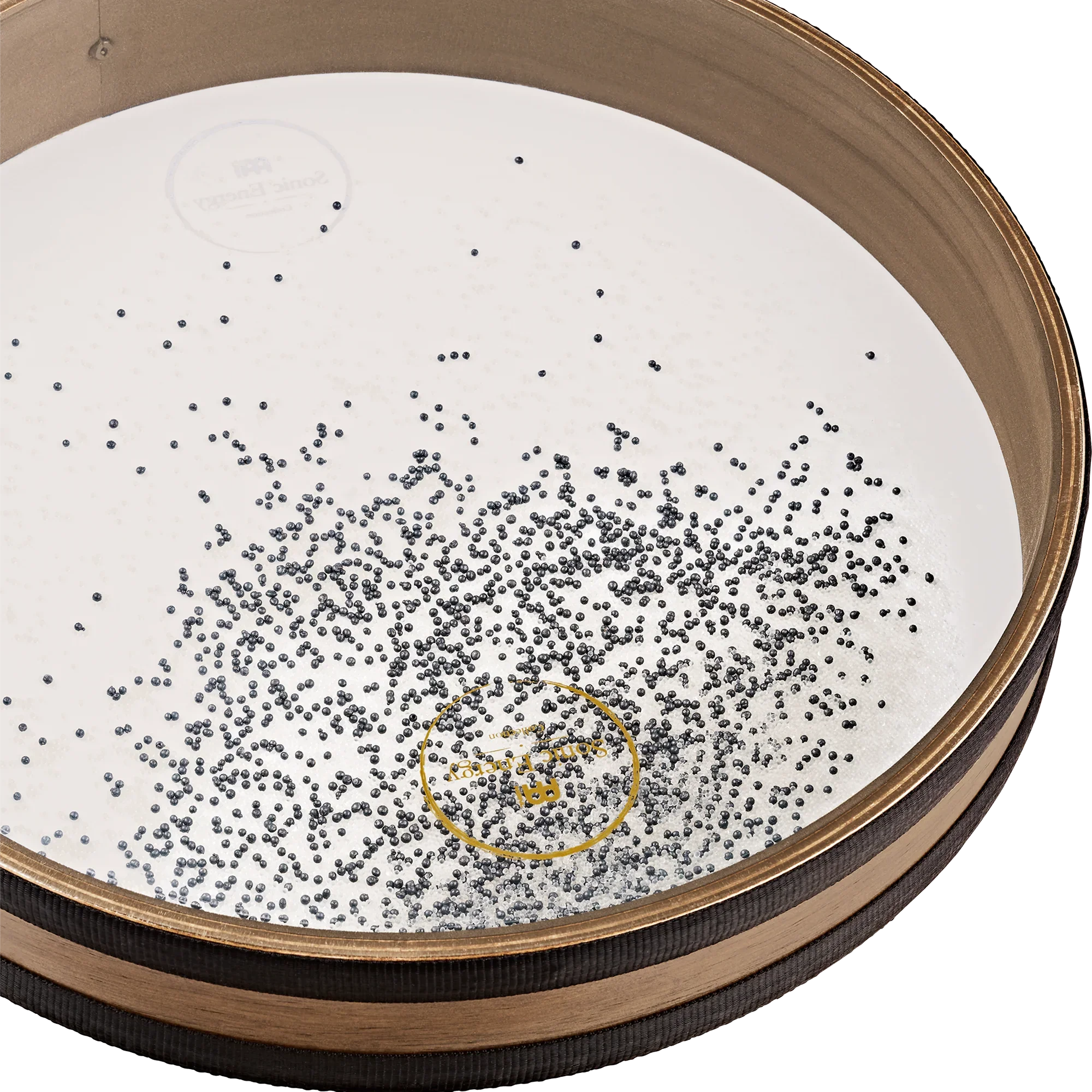 Close-up of a wooden frame drum with metal beads on a white drumhead, used for sound healing.