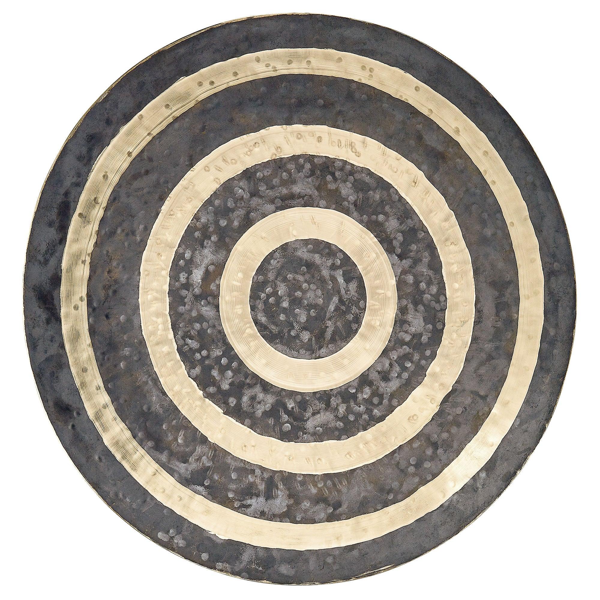 Handcrafted metal gong with concentric gold and dark rings for sound healing